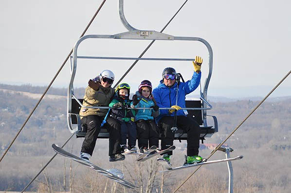 Happy Family on Ski Lift at Mount Peter